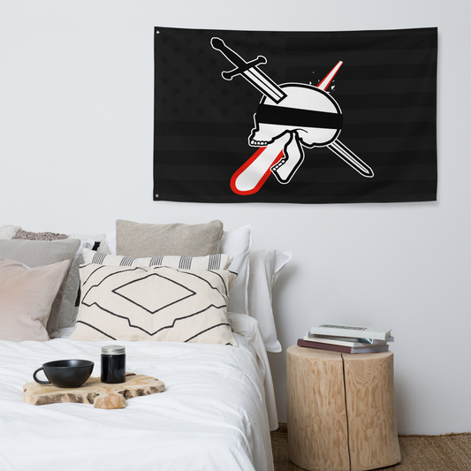 Bedroom with a black flag featuring a skull and crossed sword on the wall.