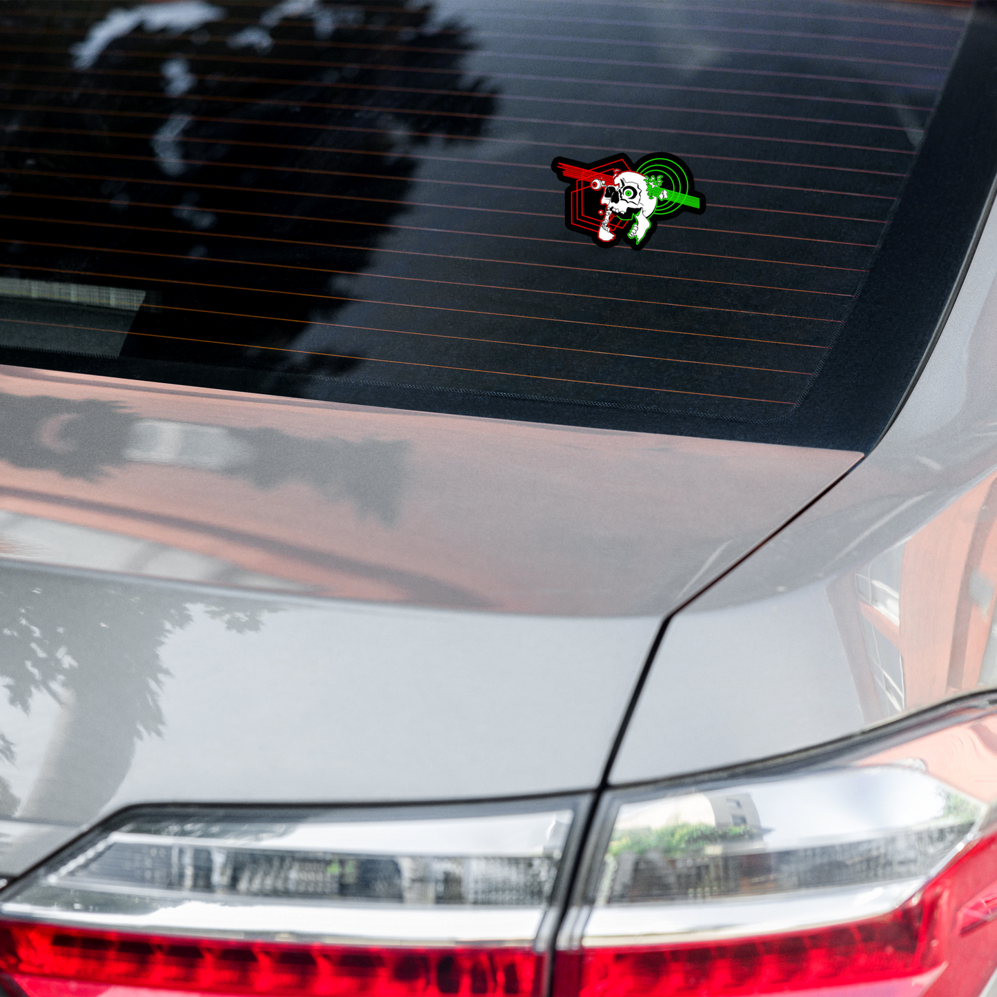 Car sticker on a car's rear window with a colorful design.