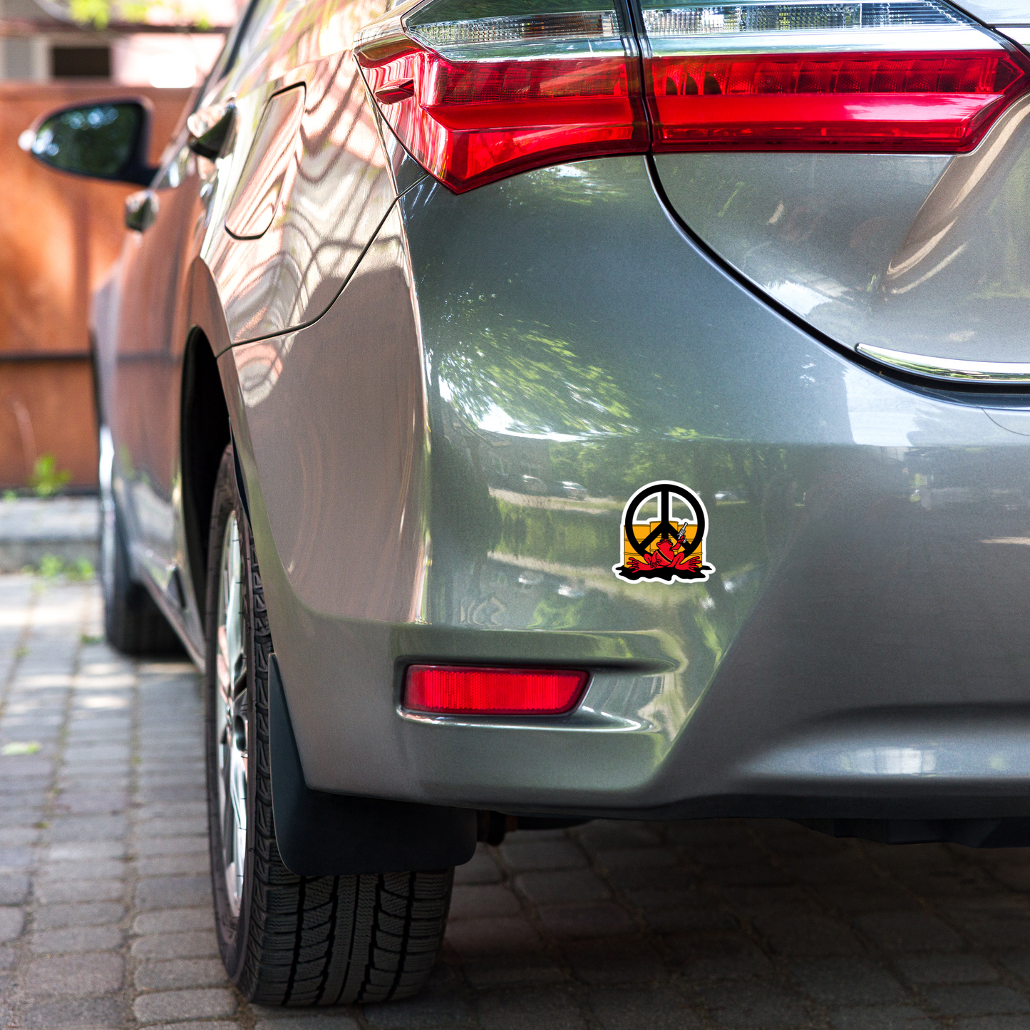 Car with a peace symbol sticker on the back