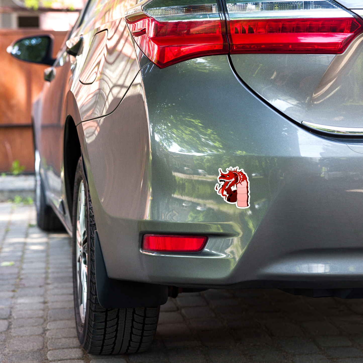 Red chinese dragon sticker on a car bumper