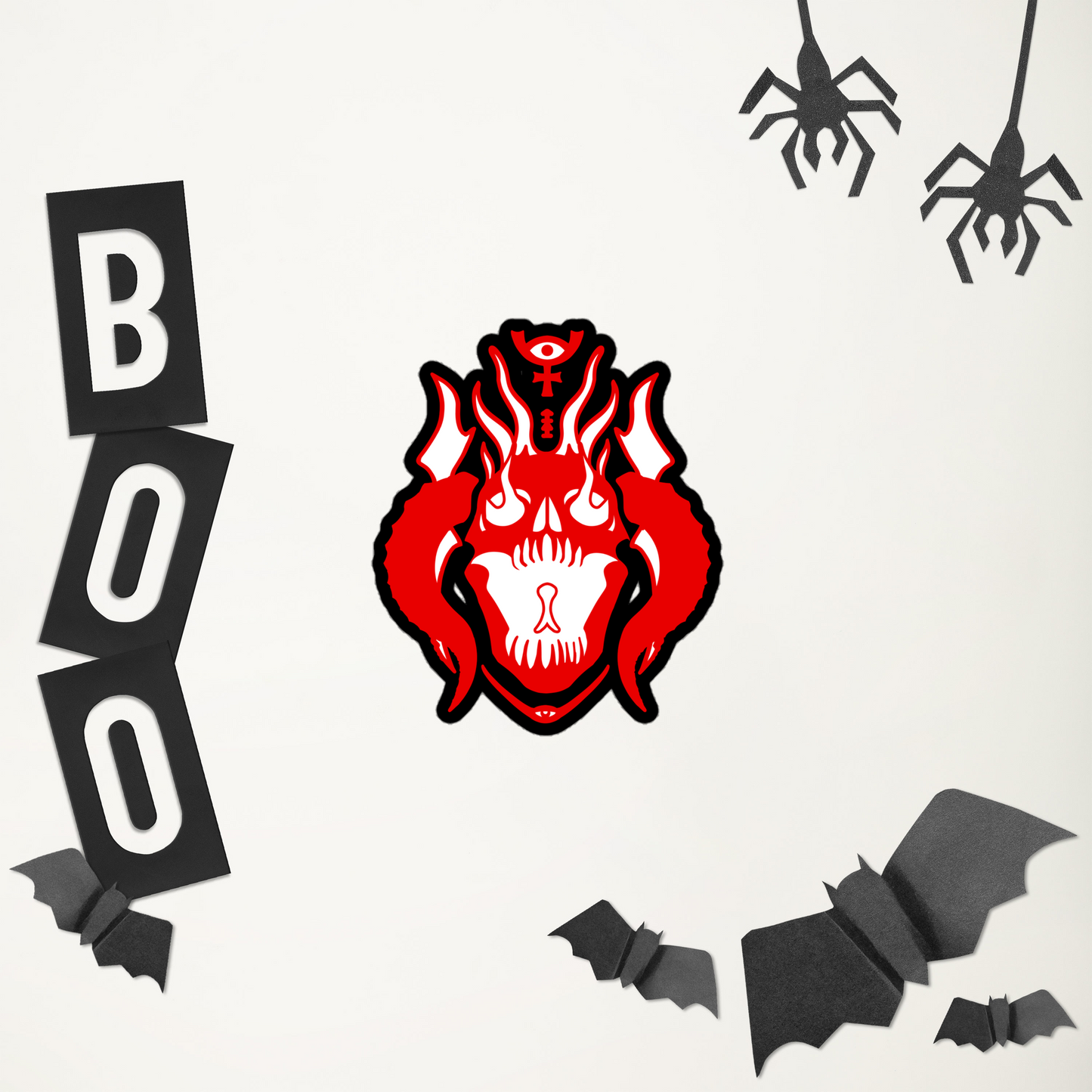 Halloween-themed decorations including a red demon skull design, 'BOO' letters, bats, and spiders on a white background.