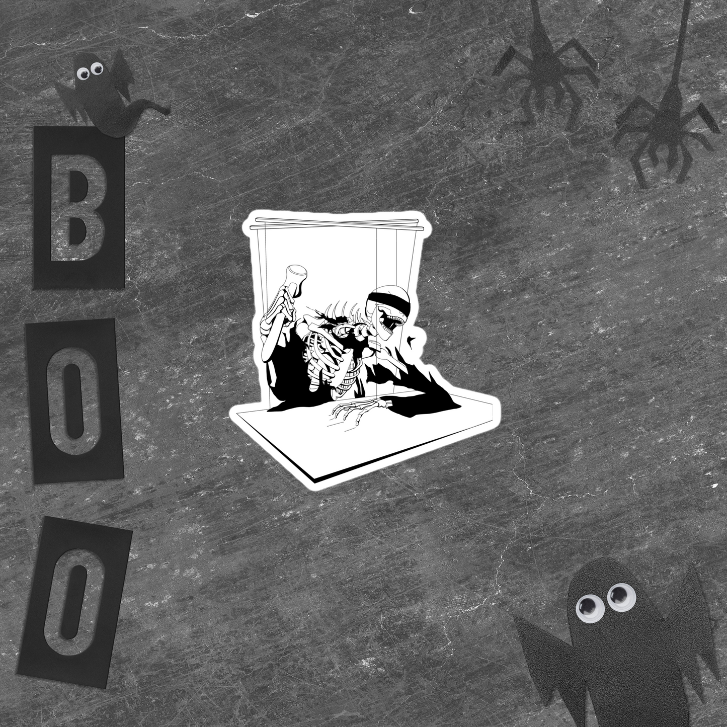 Black and white illustrated sticker of a skeleton in a coffin with 'BOO' text and spooky figures on a textured background.
