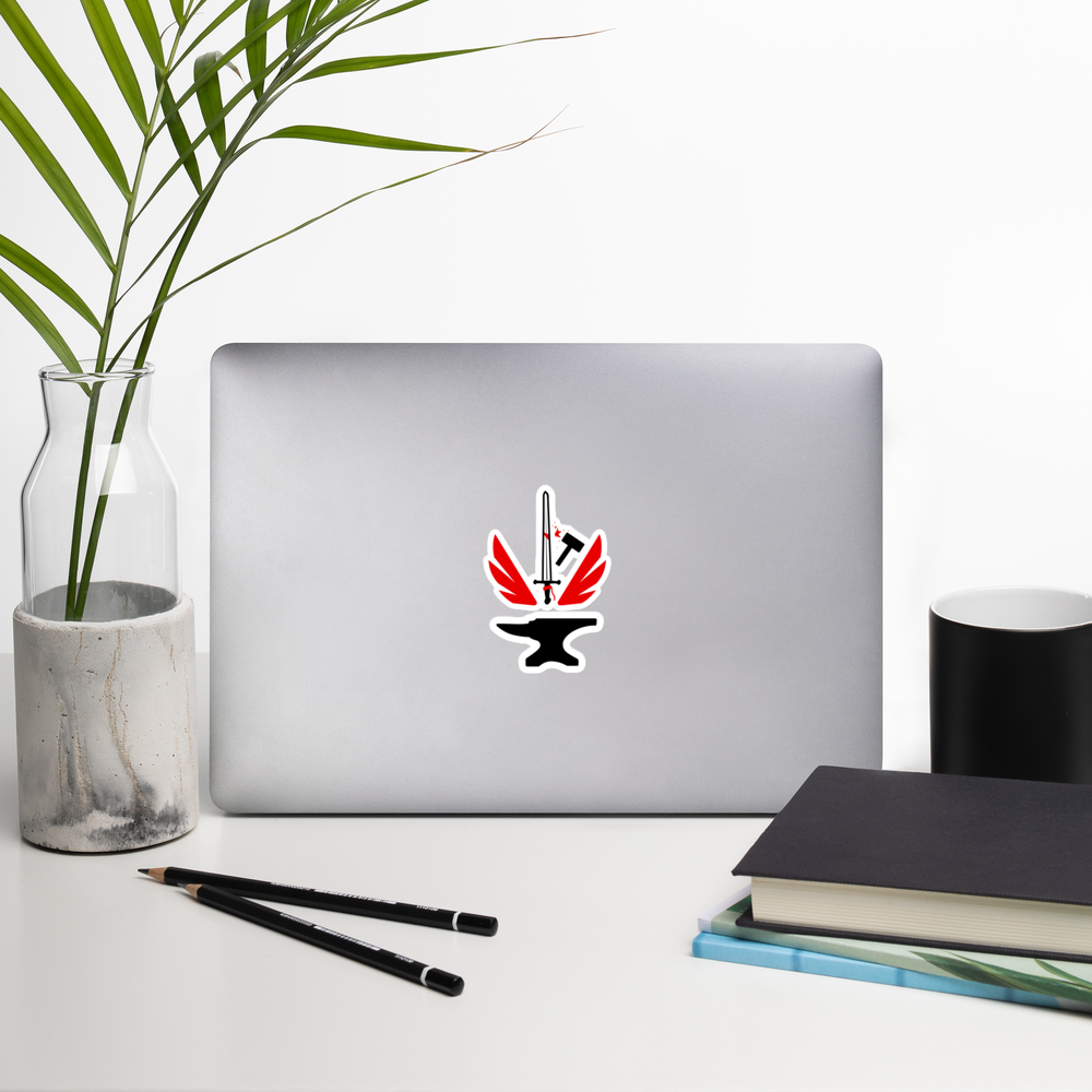 Laptop with an anvil sticker on a desk with a plant, pencils, and books.