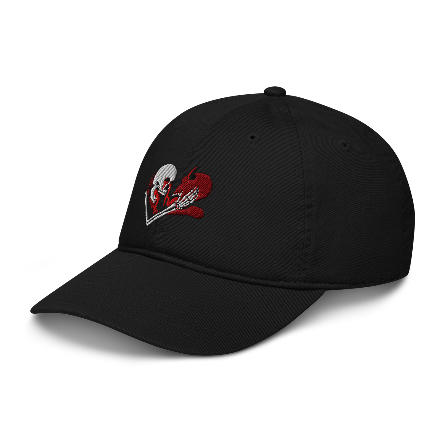 a hat facing diagonally left towards the camera with an embroidered skeleton and demon embracing each other on the front