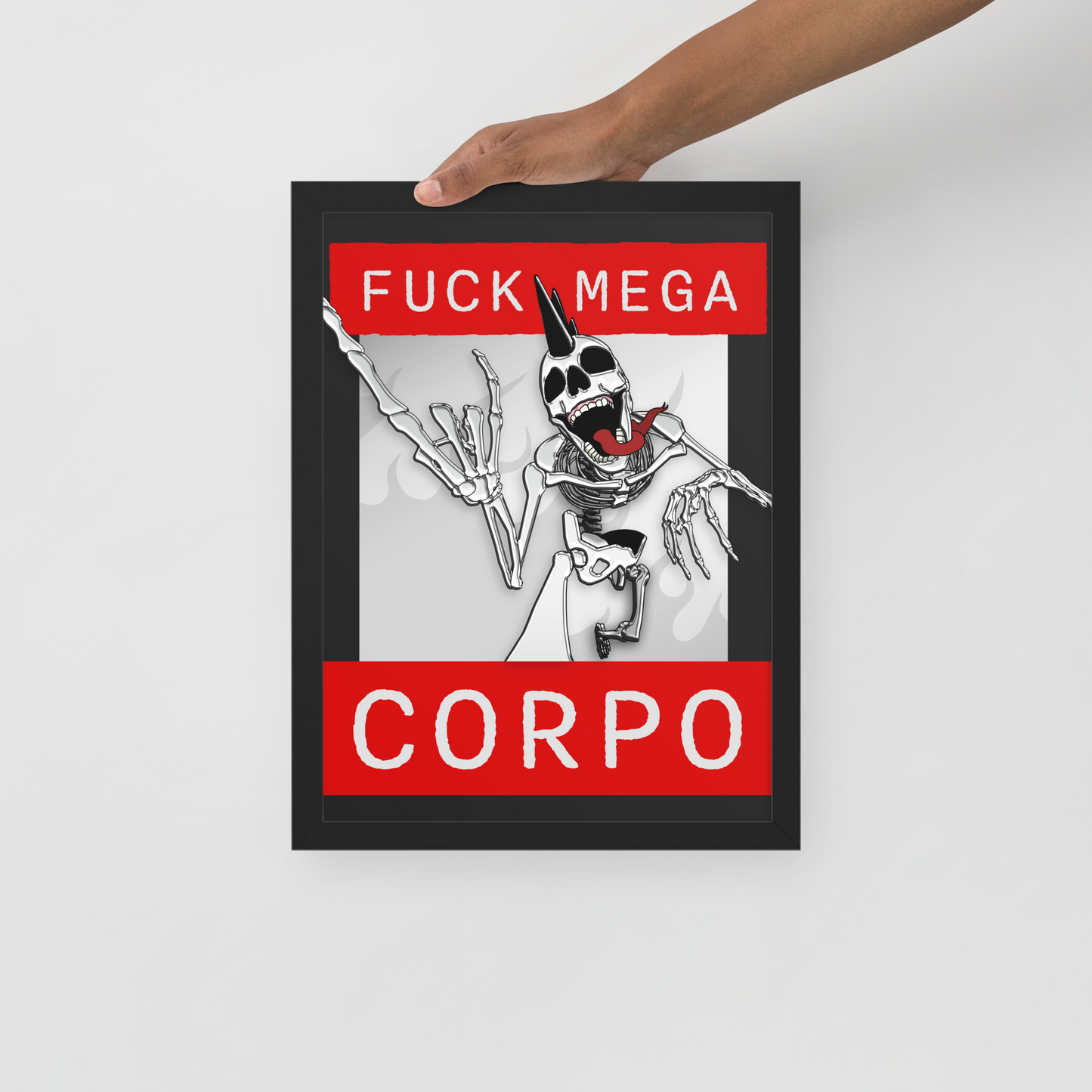 Framed artwork of a heavy metal skeleton in front of 'FUCK MEGA CORPO' text with red, white, black, and grey coloration being held by hand in front of a white background