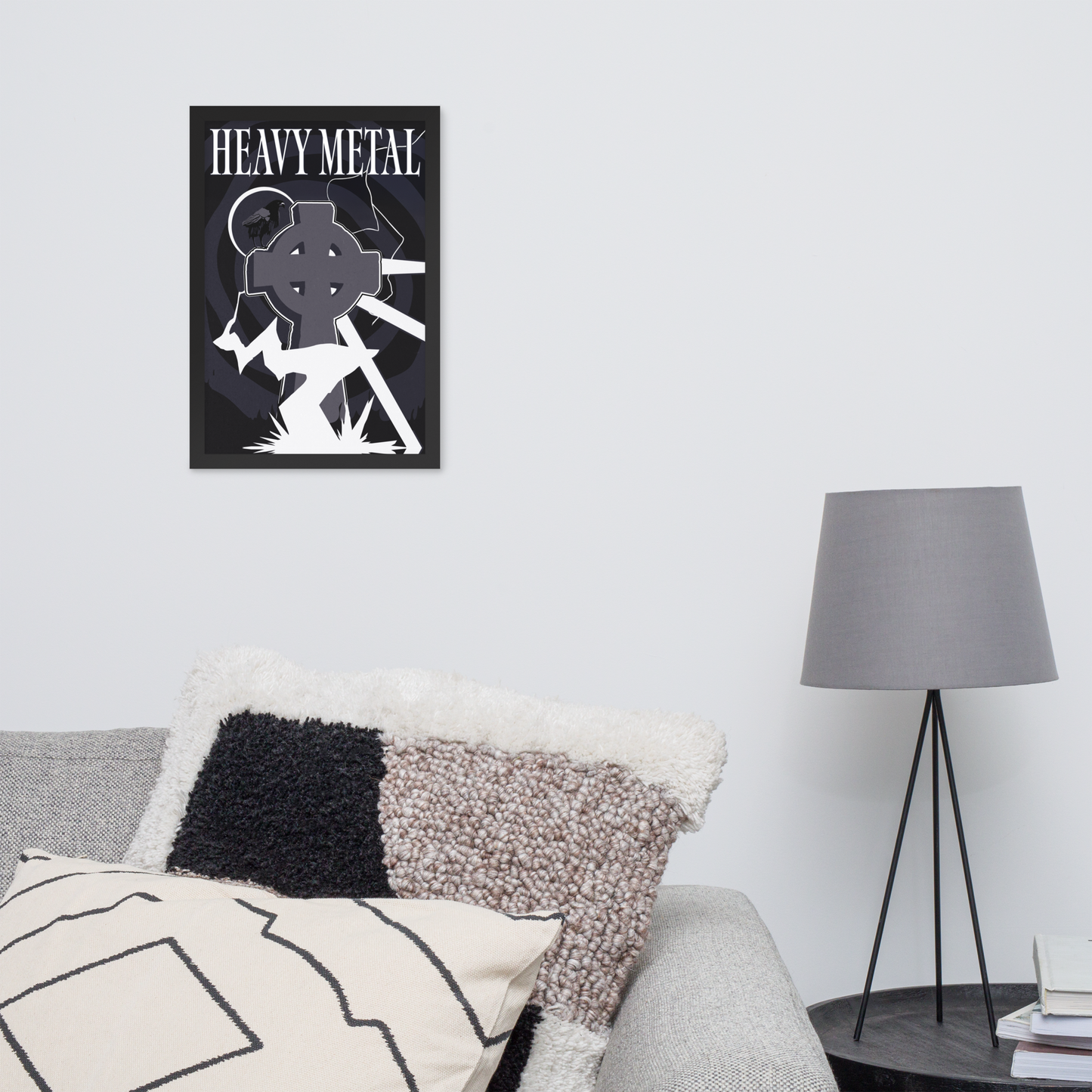 Framed 'Heavy Metal' poster on a wall above a sofa with decorative pillows and a lamp.