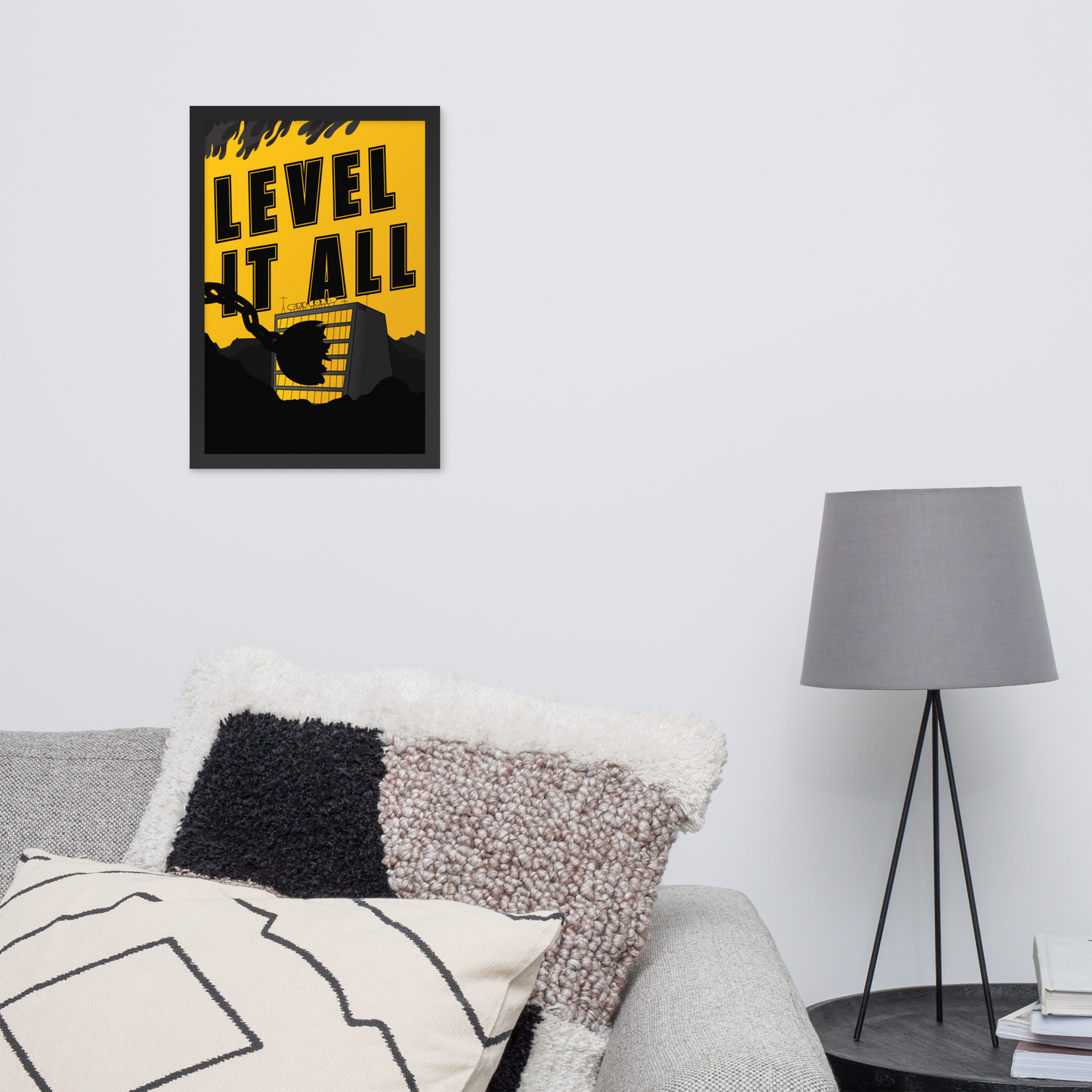 Framed poster with 'Level It All' text in a living room setting.