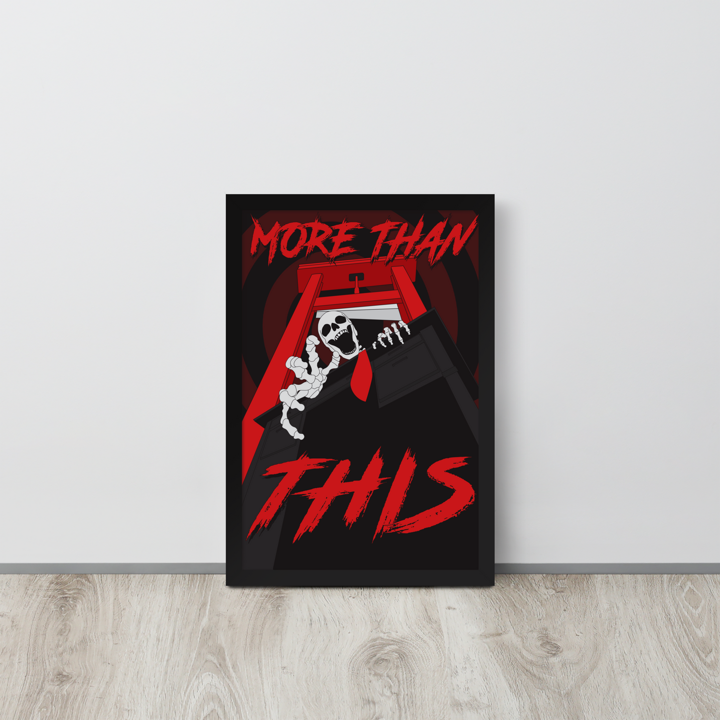 Framed poster with red and white text on a black background, leaning against a light gray wall.