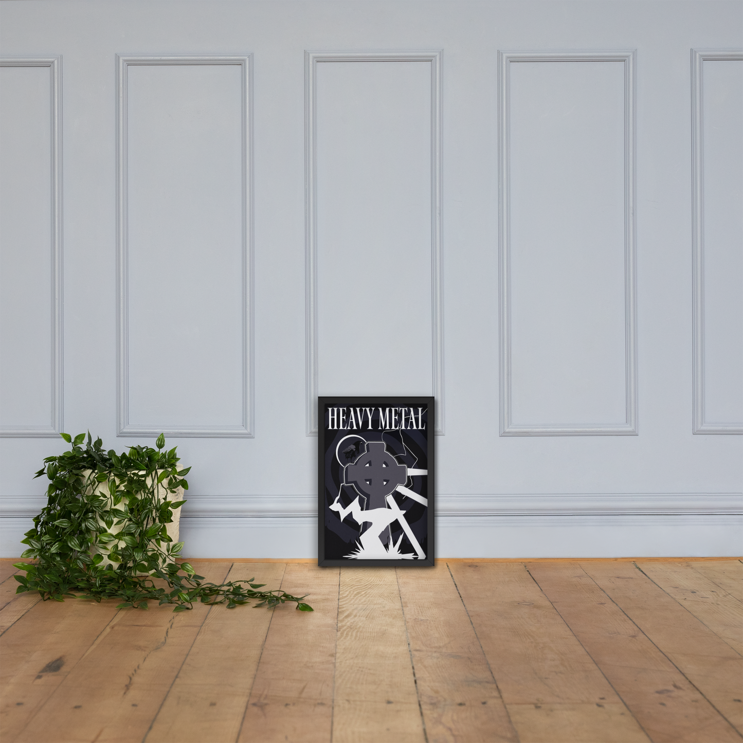 Decorative poster with 'Heavy Metal' design on a wall next to a plant.