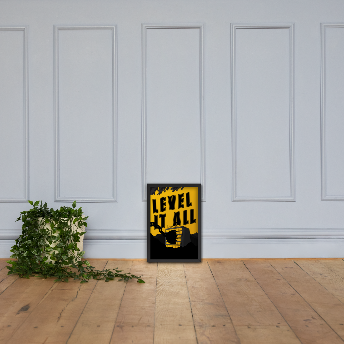 Yellow and black framed poster with 'LEVEL IT ALL' text on a white paneled wall.
