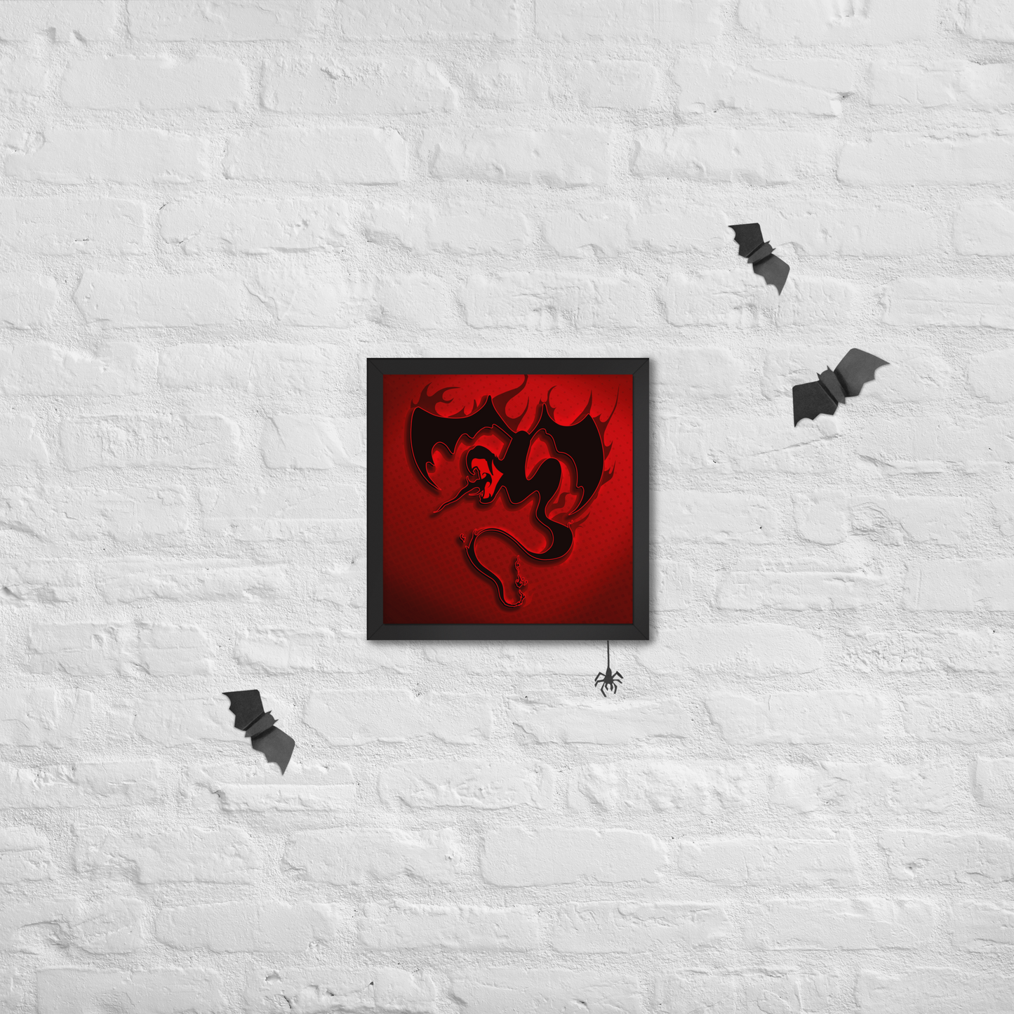 Framed artwork of a black dragon on a red background against a white brick wall with decorative bats.