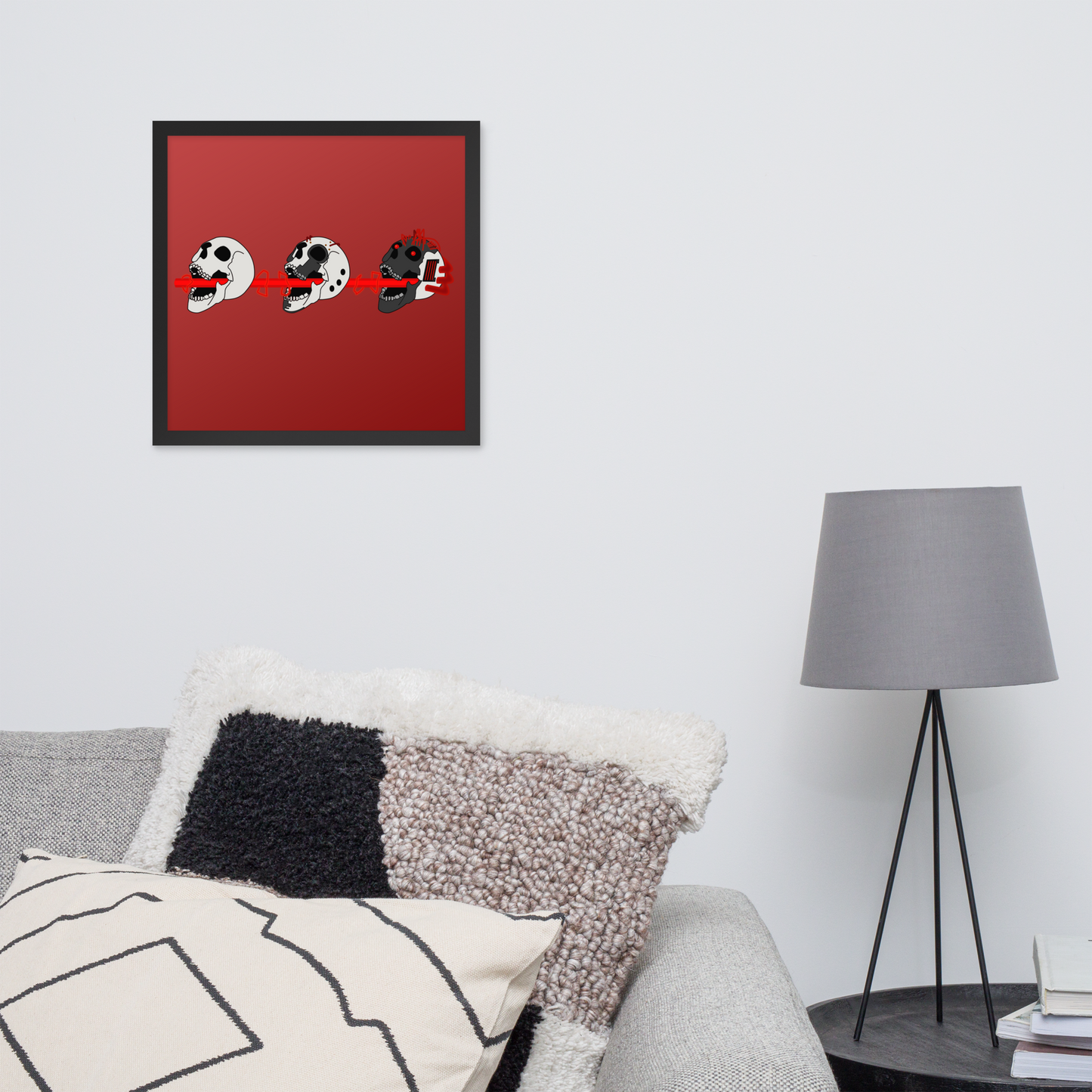 Framed artwork with cyberpunk skull illustrations on a red background in a living room setting.