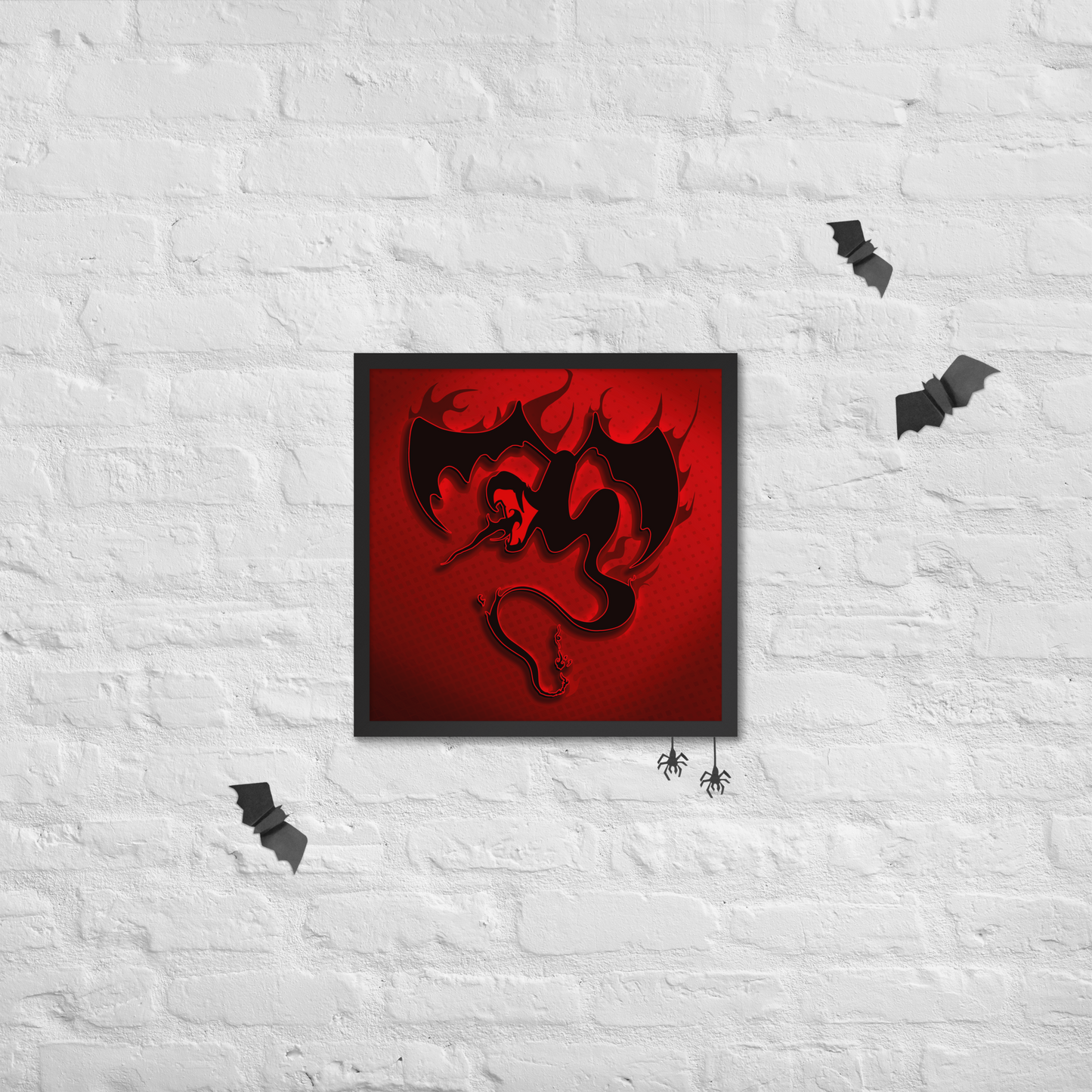 Framed artwork of a black dragon on a red background against a white brick wall.