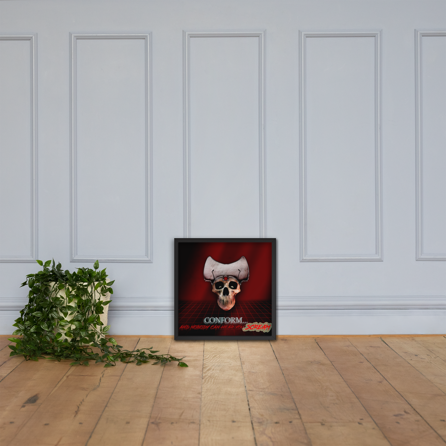 Framed poster with a skull design on a white paneled wall.