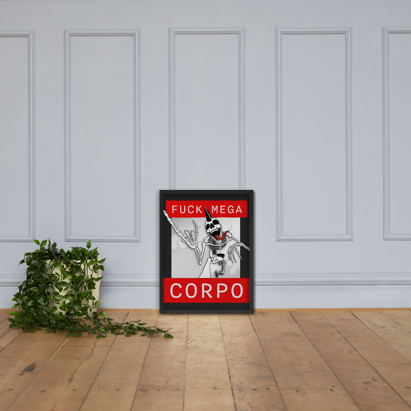 Framed 18x24 artwork of a heavy metal skeleton in front of 'FUCK MEGA CORPO' text with red, white, black, and grey coloration on a wall with a plant on the floor.