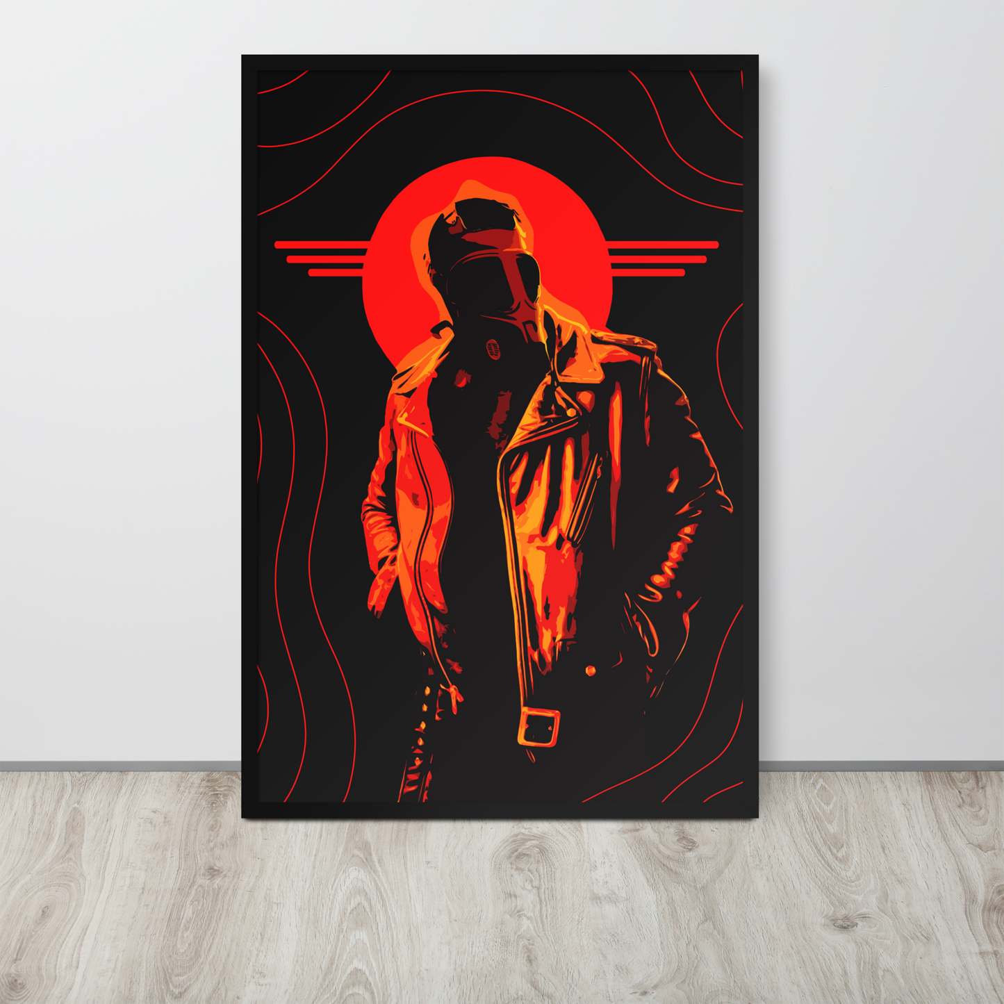 Framed artwork of a silhouette with a red circle on a black background, leaning against a white wall.