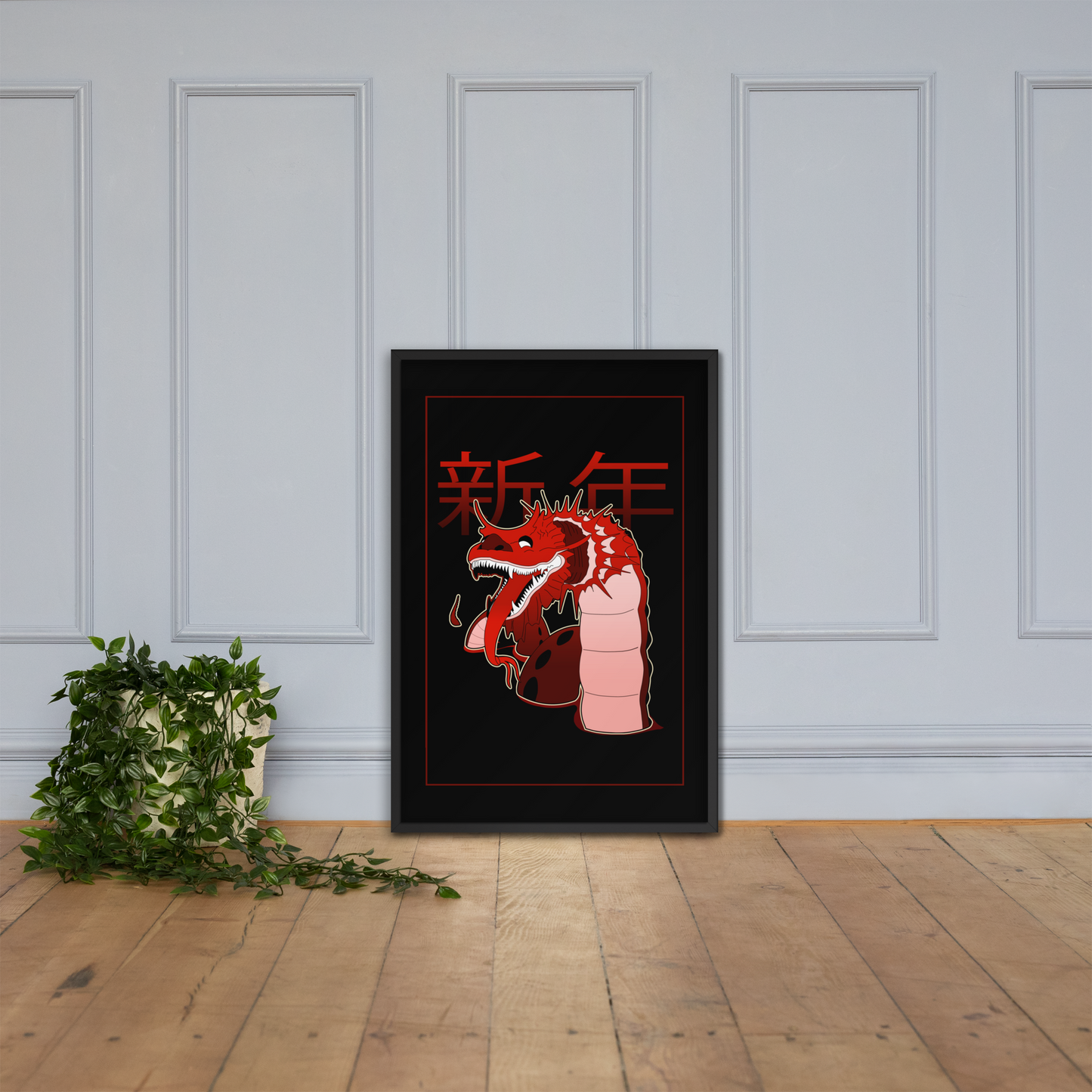 Framed artwork of a red dragon with Chinese characters on a white wall.