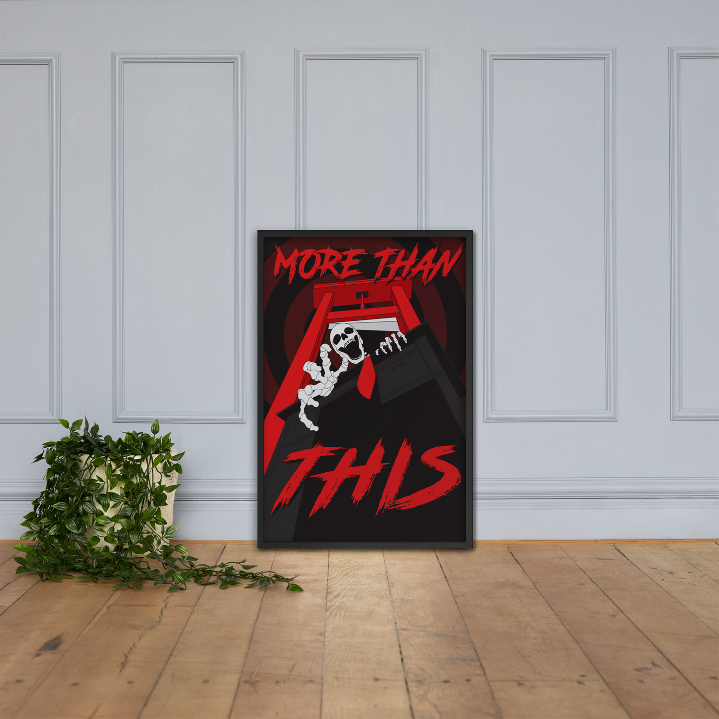 large framed poster with red and black design on a white paneled wall.