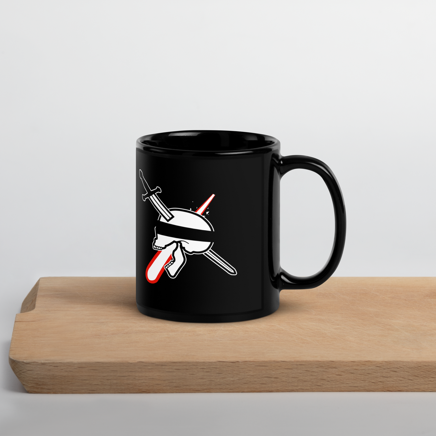 Black mug with a graphic design on a wooden surface