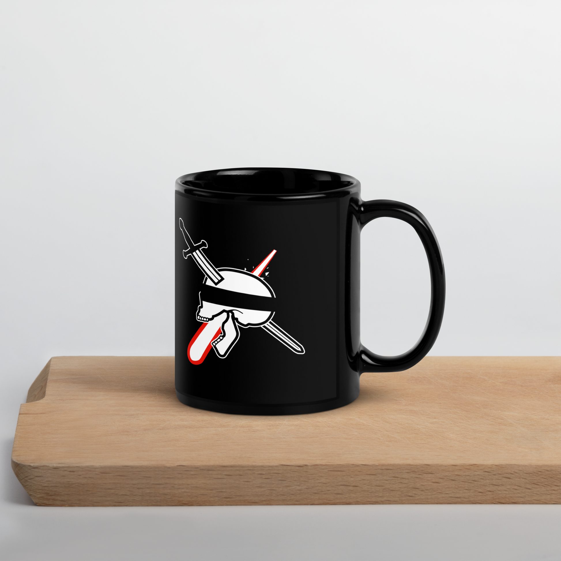 Black mug with a graphic design on a wooden surface