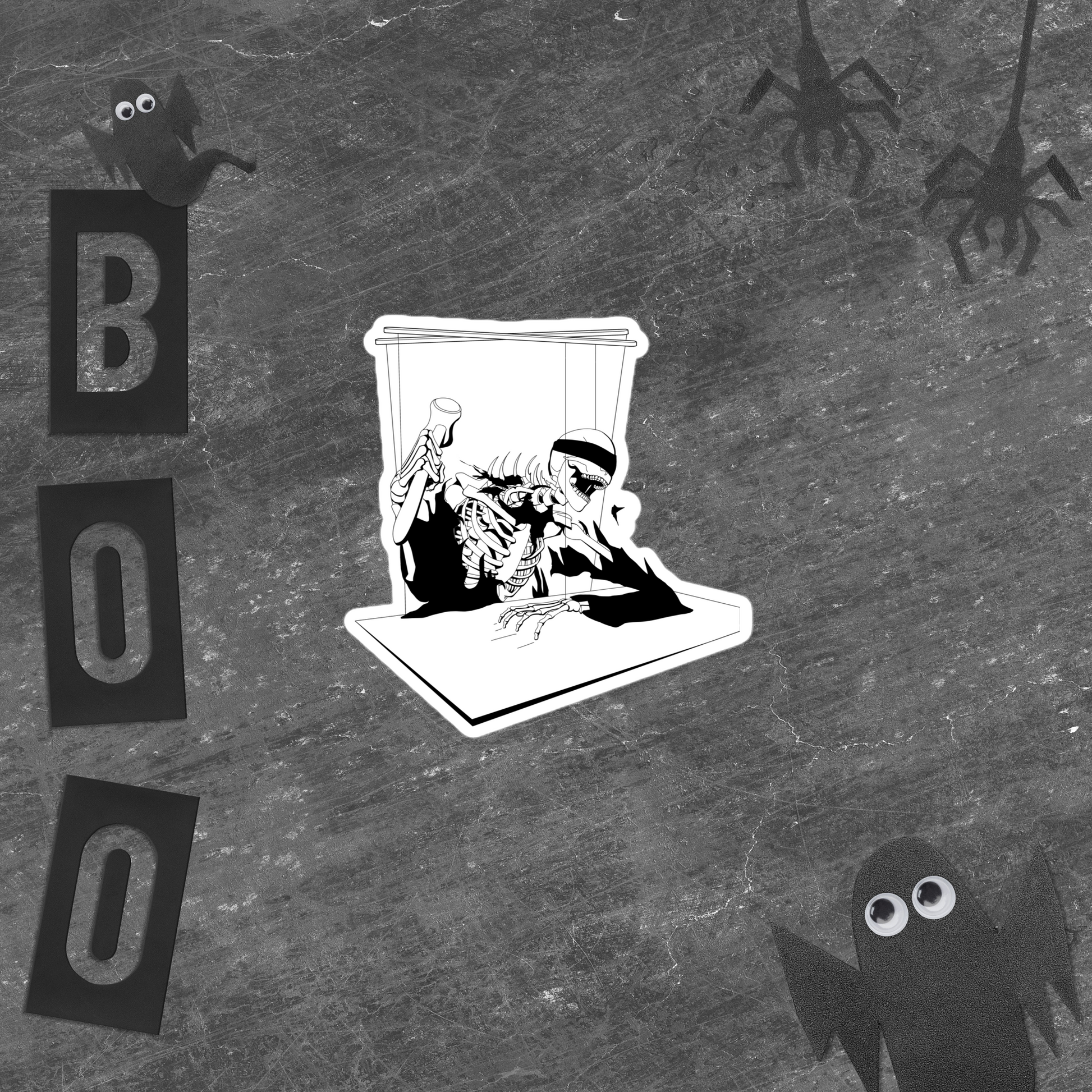 Black and white illustrated sticker of a skeleton in a coffin with 'BOO' text and spooky figures on a textured background.