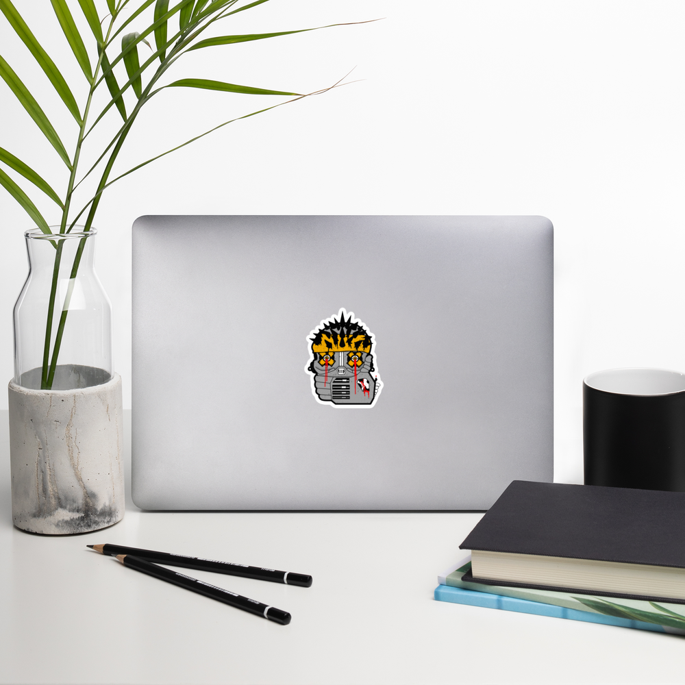 Laptop with a sticker on a desk with a plant, pencils, and books.