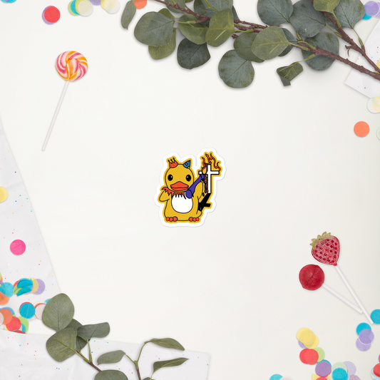 Colorful cartoon duck character with a large candle on a white background with green leaves and colorful candies.