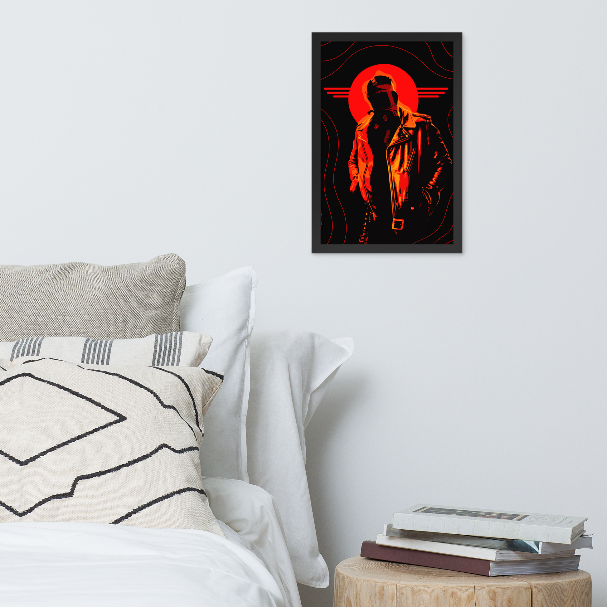 Framed artwork of a mysterious figure in a gas mask in front of an orange circle and wavy lines above a bed.