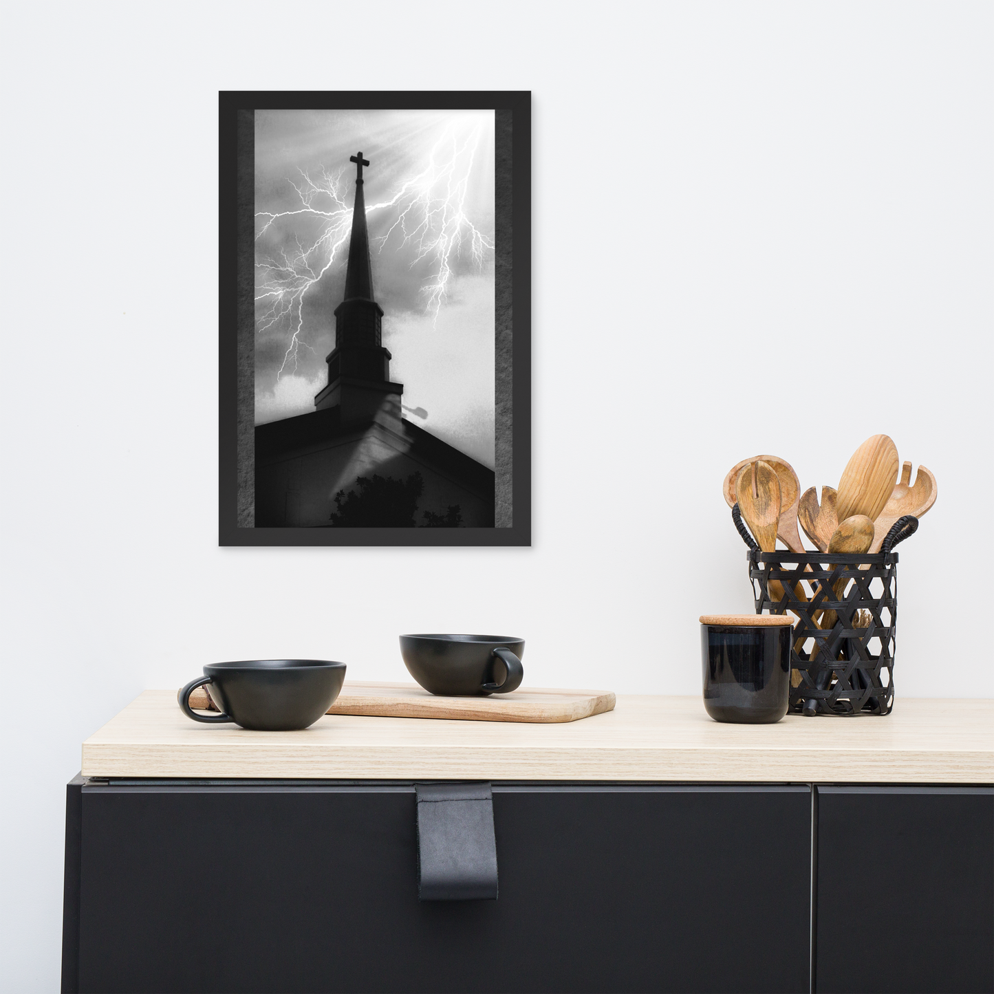 12x18 poster of a shadowy church in front of a lightning strike in grainy black and white heavy metal style over a minimalist black kitchen setup