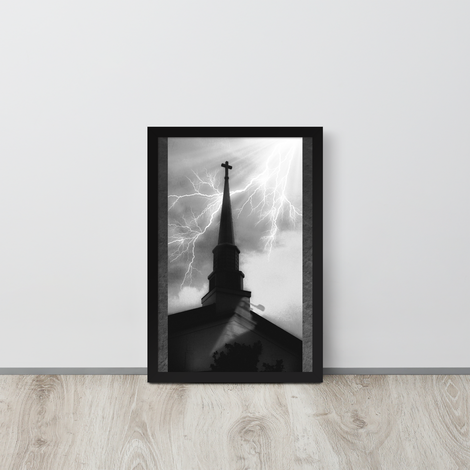 12x18 poster of a shadowy church in front of a lightning strike in grainy black and white heavy metal style leaning on a white wall