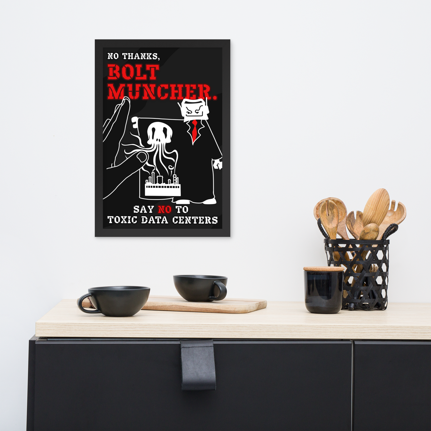A framed black poster with red and white text reading 'NO THANKS, BOLT MUNCHER.' hangs on a light gray wall above a cabinet.