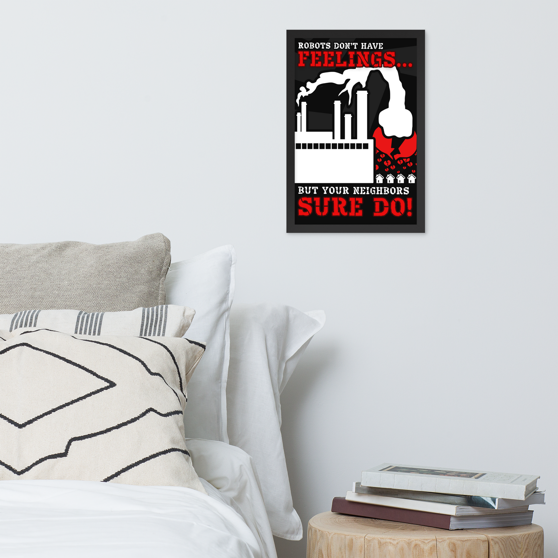A framed black-and-red poster with the text 'ROBOTS DON'T HAVE FEELINGS.