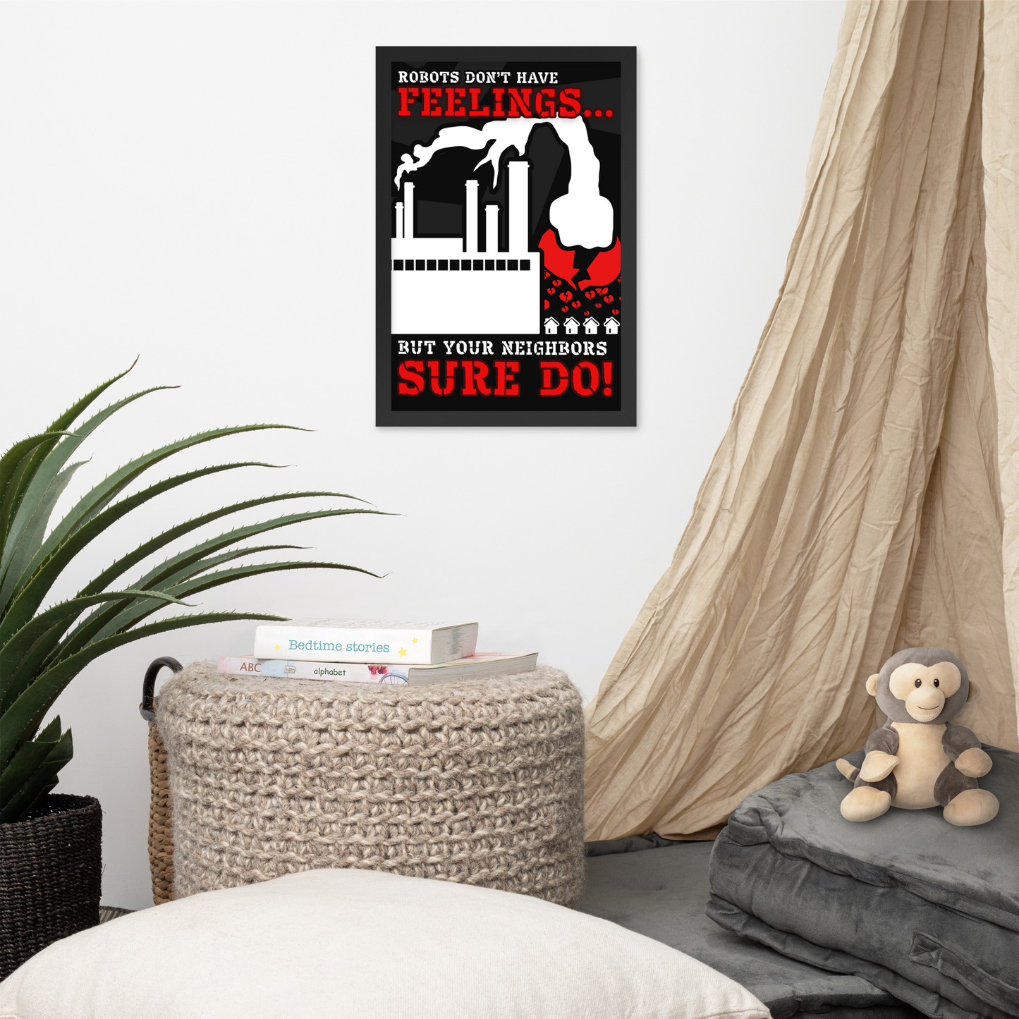 A framed wall poster with a black background, red and white text reading 'ROBOTS DON'T HAVE FEELINGS.