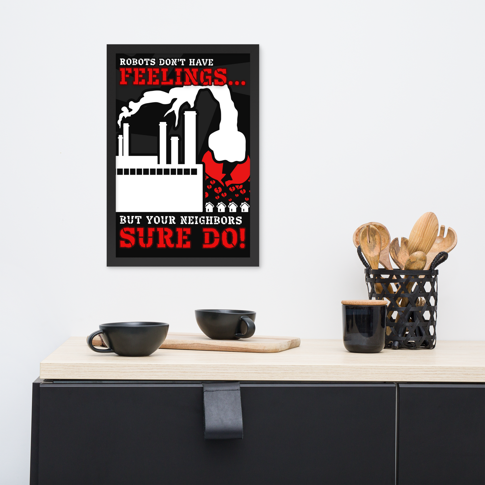 A framed wall poster with a black, white, and red robot illustration and the text 'ROBOTS DON'T HAVE FEELINGS.