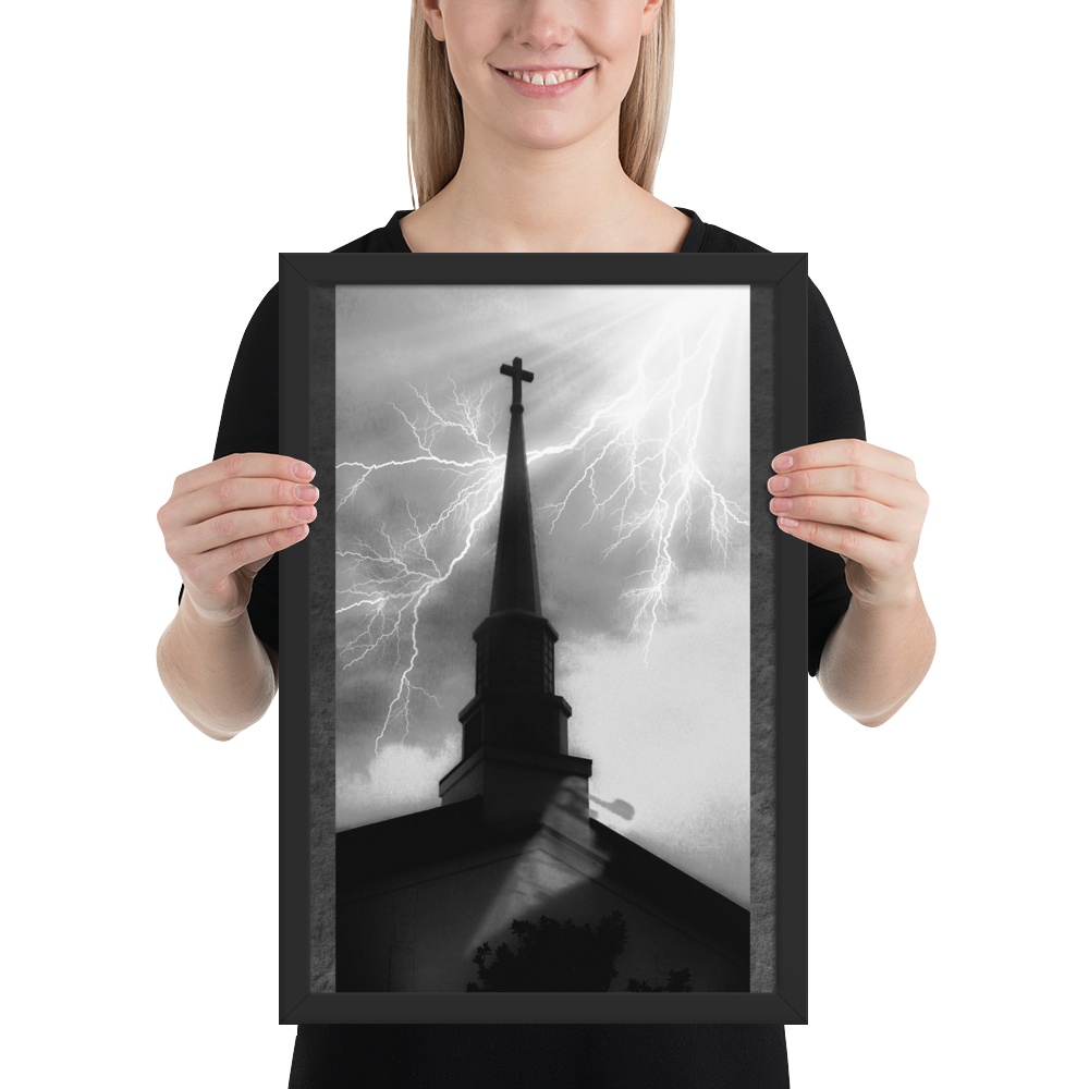 12x18 poster of a shadowy church in front of a lightning strike in grainy black and white heavy metal style being held by a smiling woman