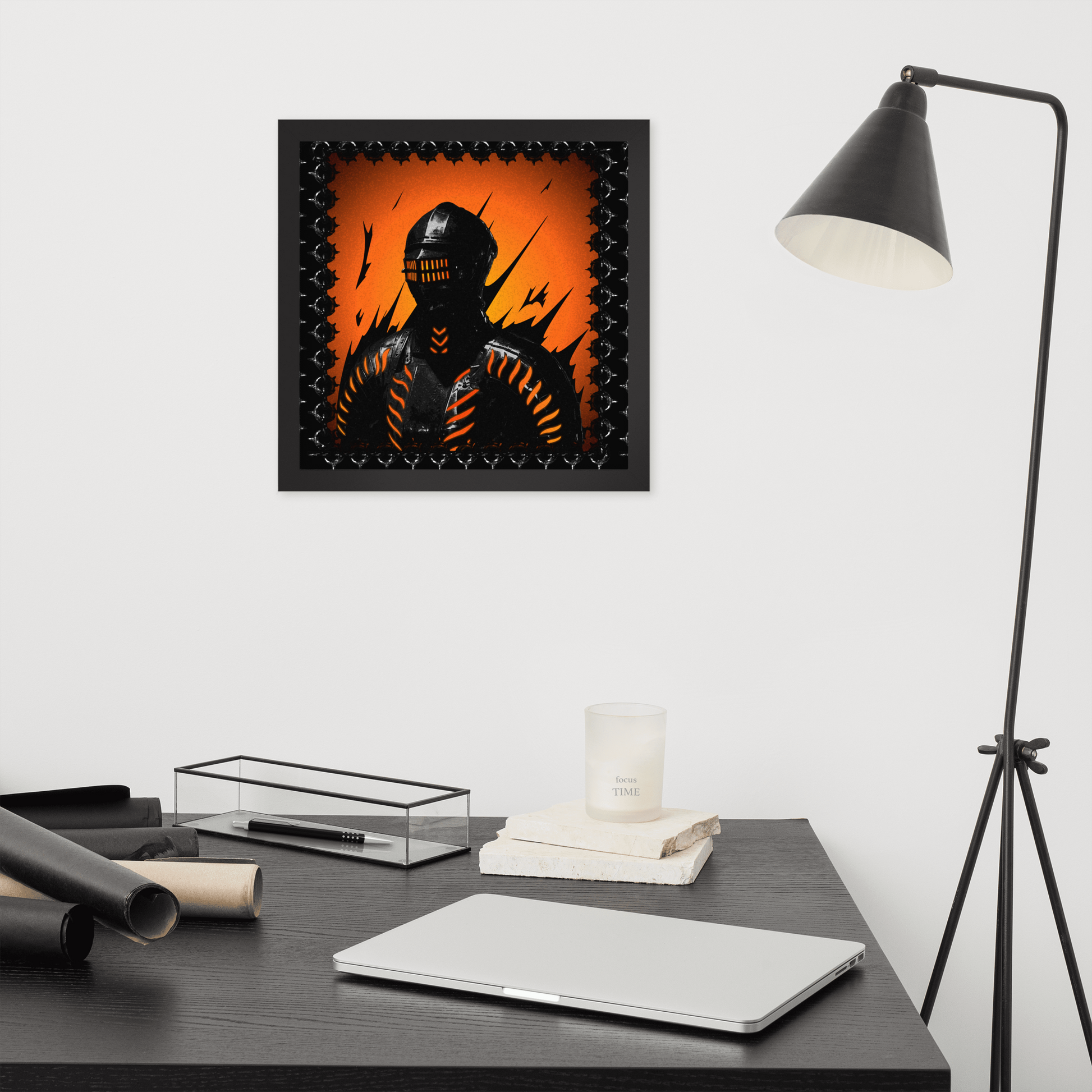 Framed artwork of a knight with an orange and black background on a wall above a desk.