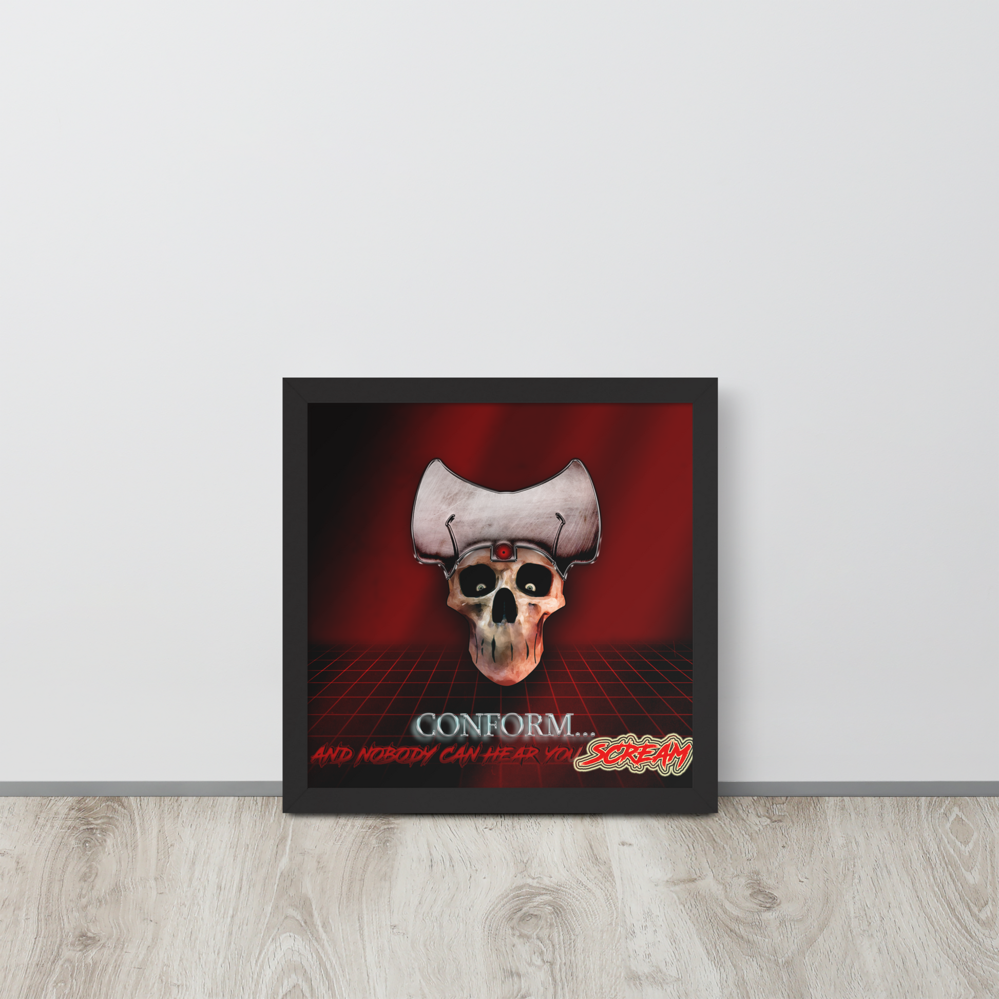 Framed red artwork with a skull and text on a red background, displayed on a light wooden floor.