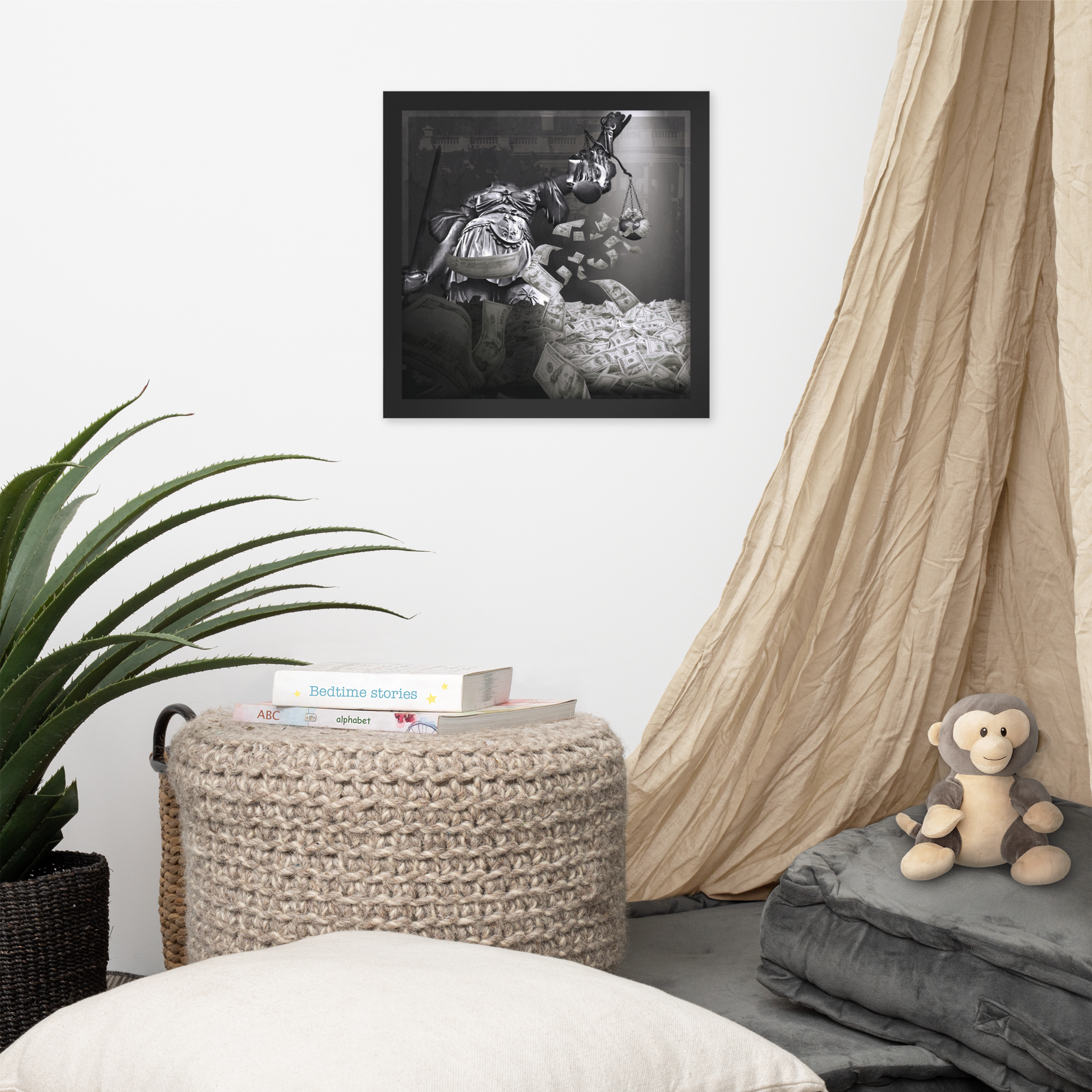 Living room with a framed black and white photo, plant, ottoman, and monkey plush toy.