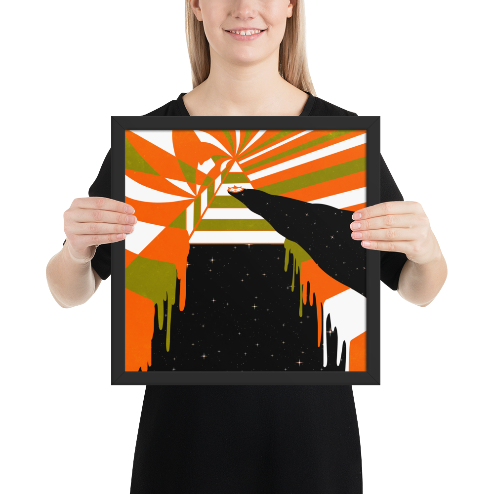 Person holding a framed abstract art piece with orange, green, and black colors.