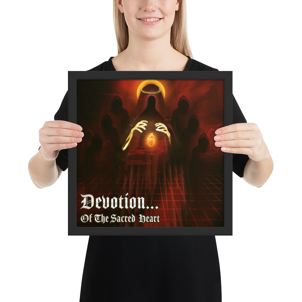 Person holding a framed artwork with religious design and text.