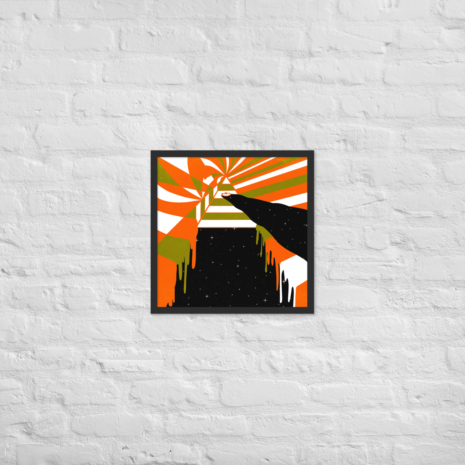 Abstract art print with orange, green, and black colors on a white brick wall.