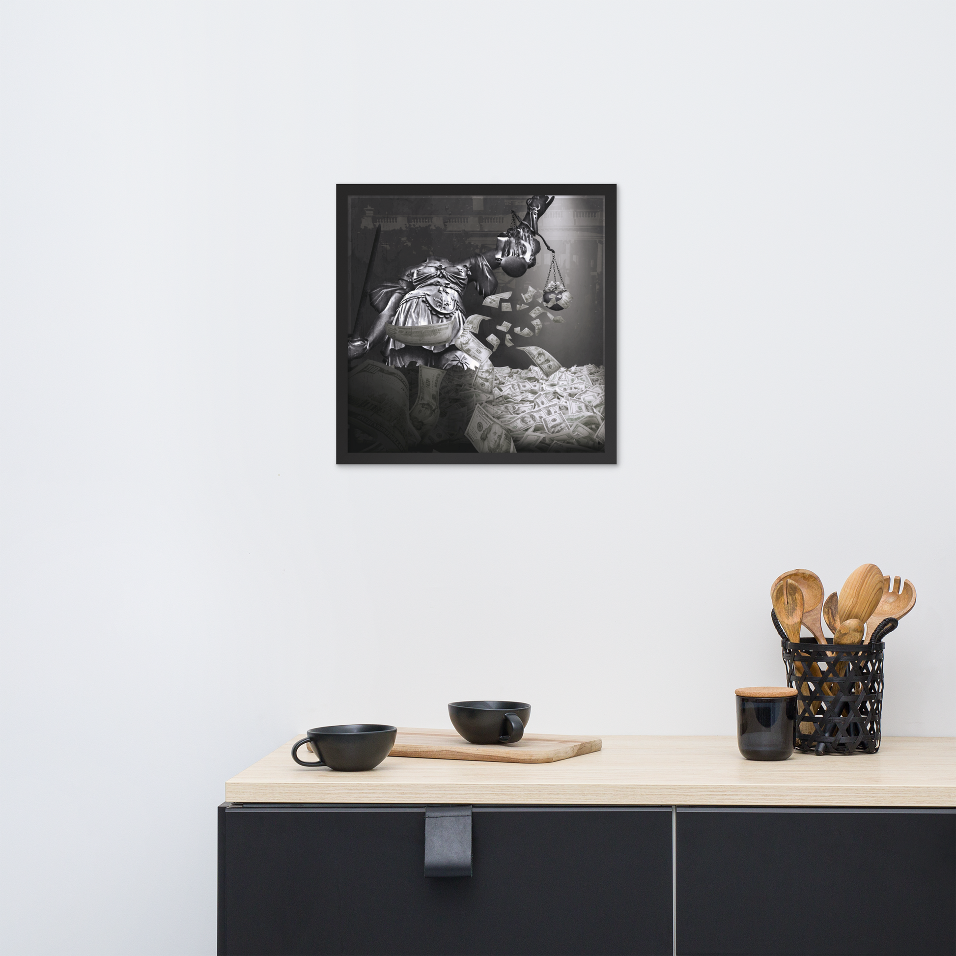 Framed black and white photograph of a person in a wheelchair on a wall above a kitchen counter.