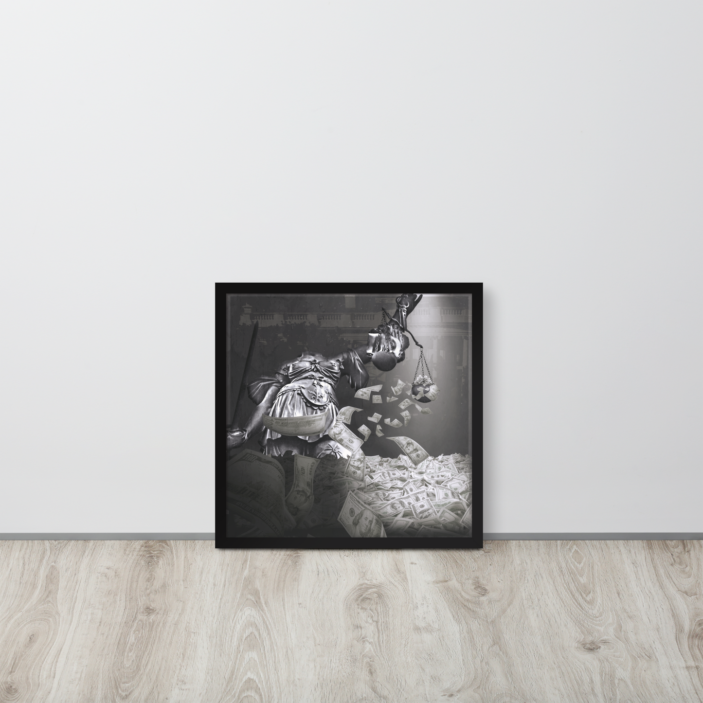 Framed black and white artwork on a light gray wall with wooden floor.