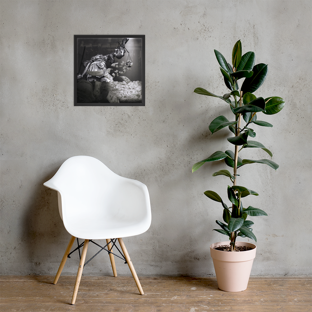 White chair and potted plant against a gray wall with a framed picture.