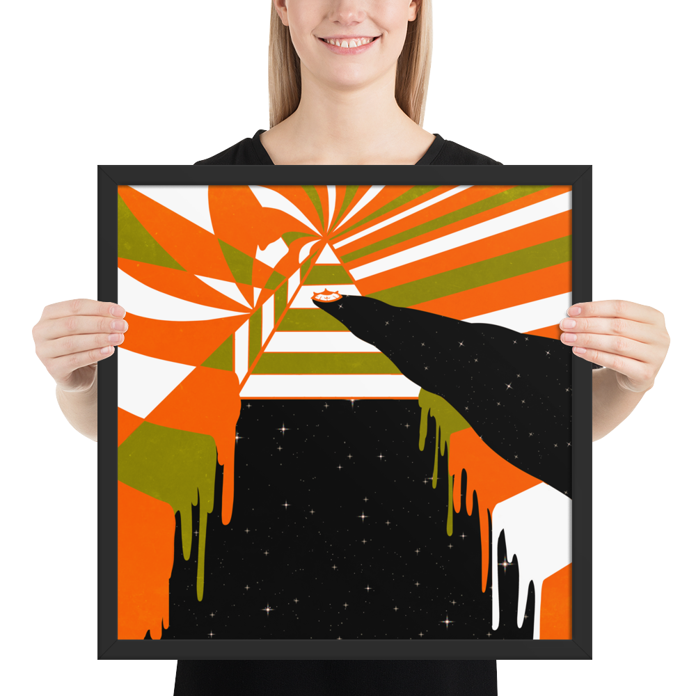 Person holding a framed abstract art piece with orange, green, and black colors.