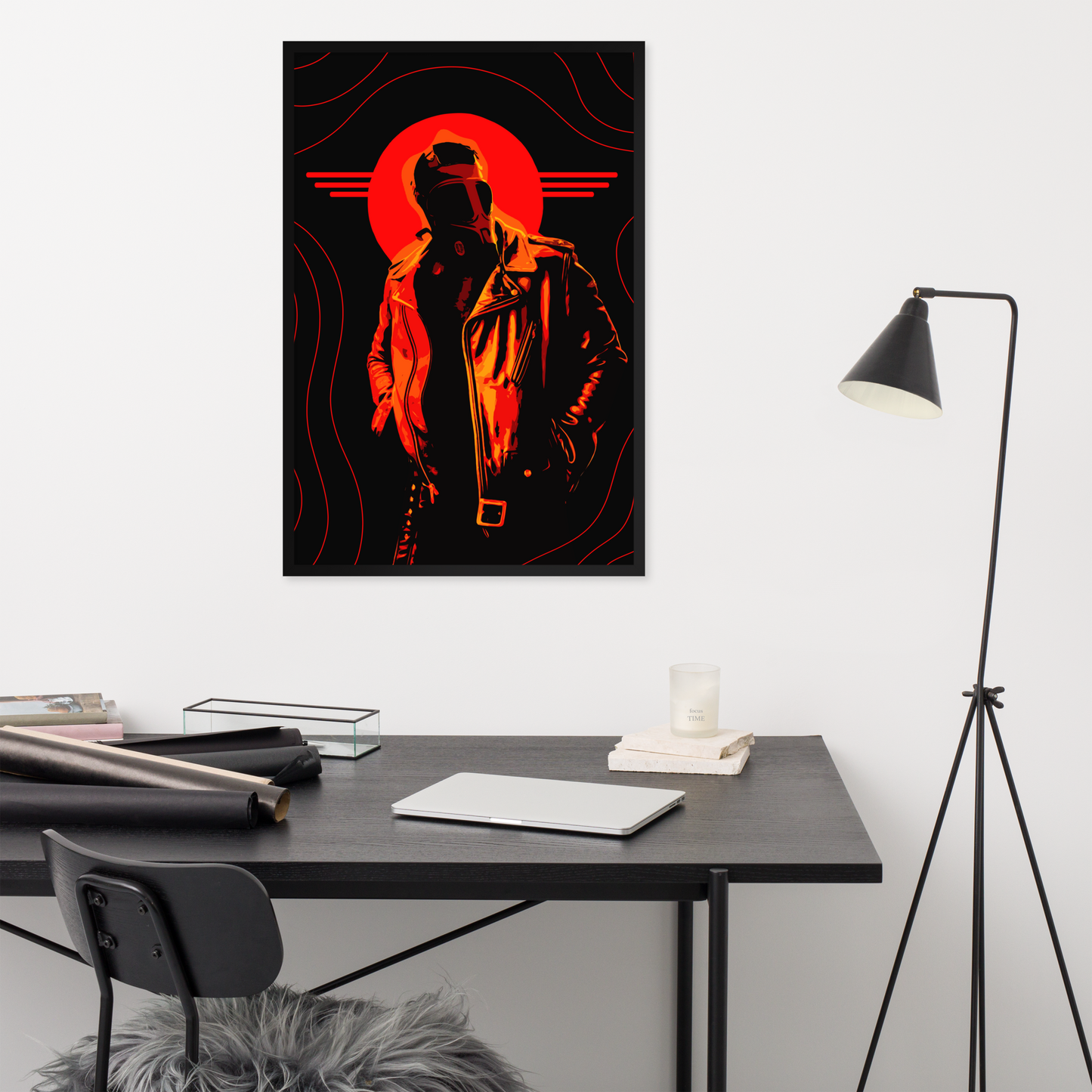 Modern office setup with a stylized poster of a person in an orange circle on the wall.