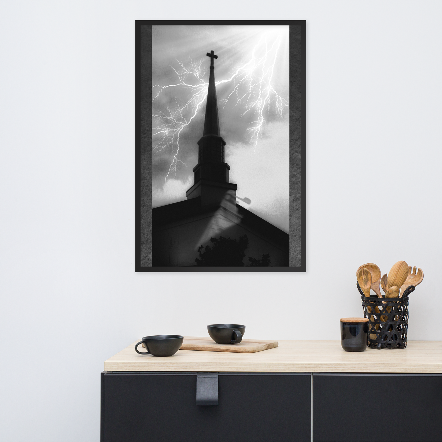 24x36 poster of a shadowy church in front of a lightning strike in grainy black and white heavy metal style over a minimalist black kitchen setup