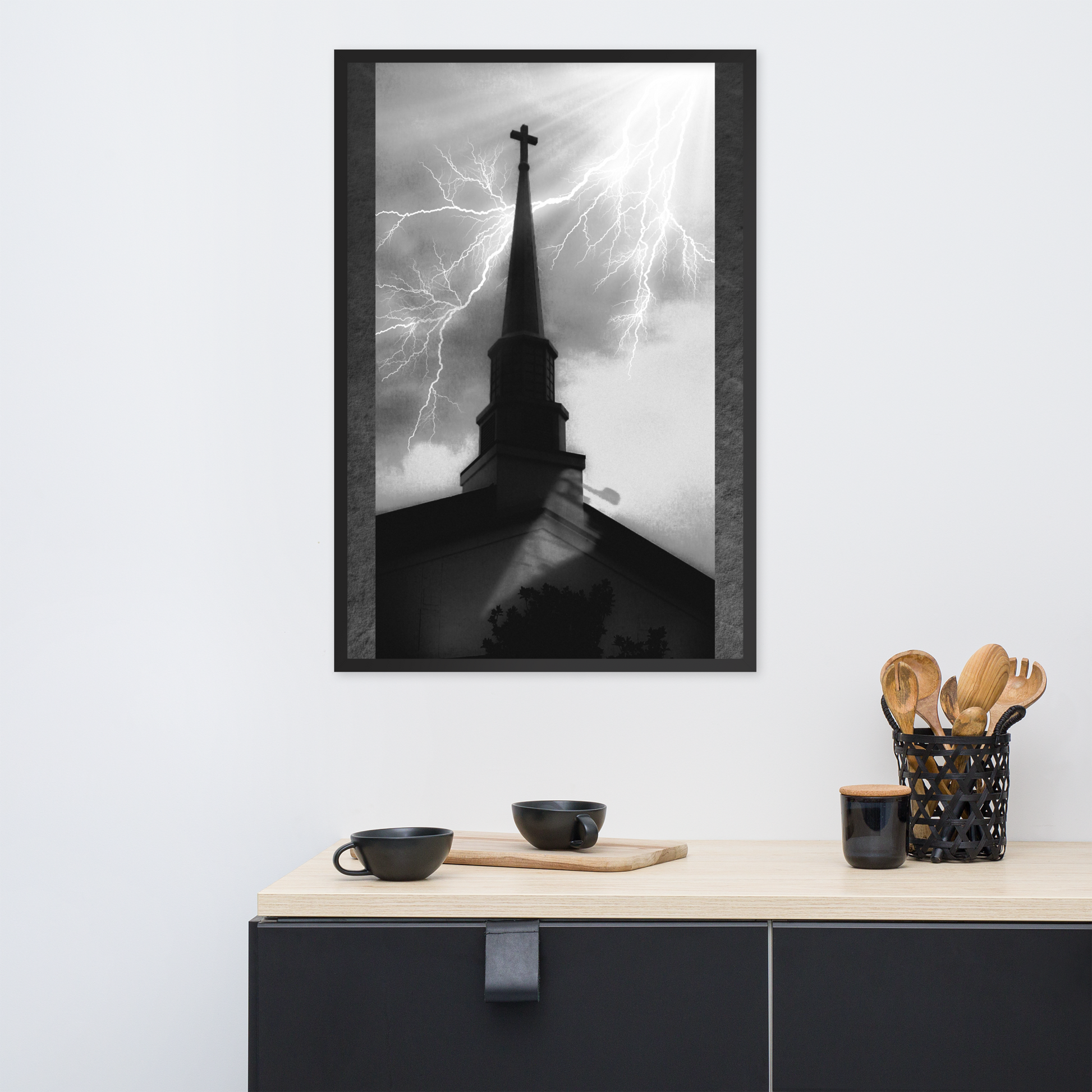 24x36 poster of a shadowy church in front of a lightning strike in grainy black and white heavy metal style over a minimalist black kitchen setup