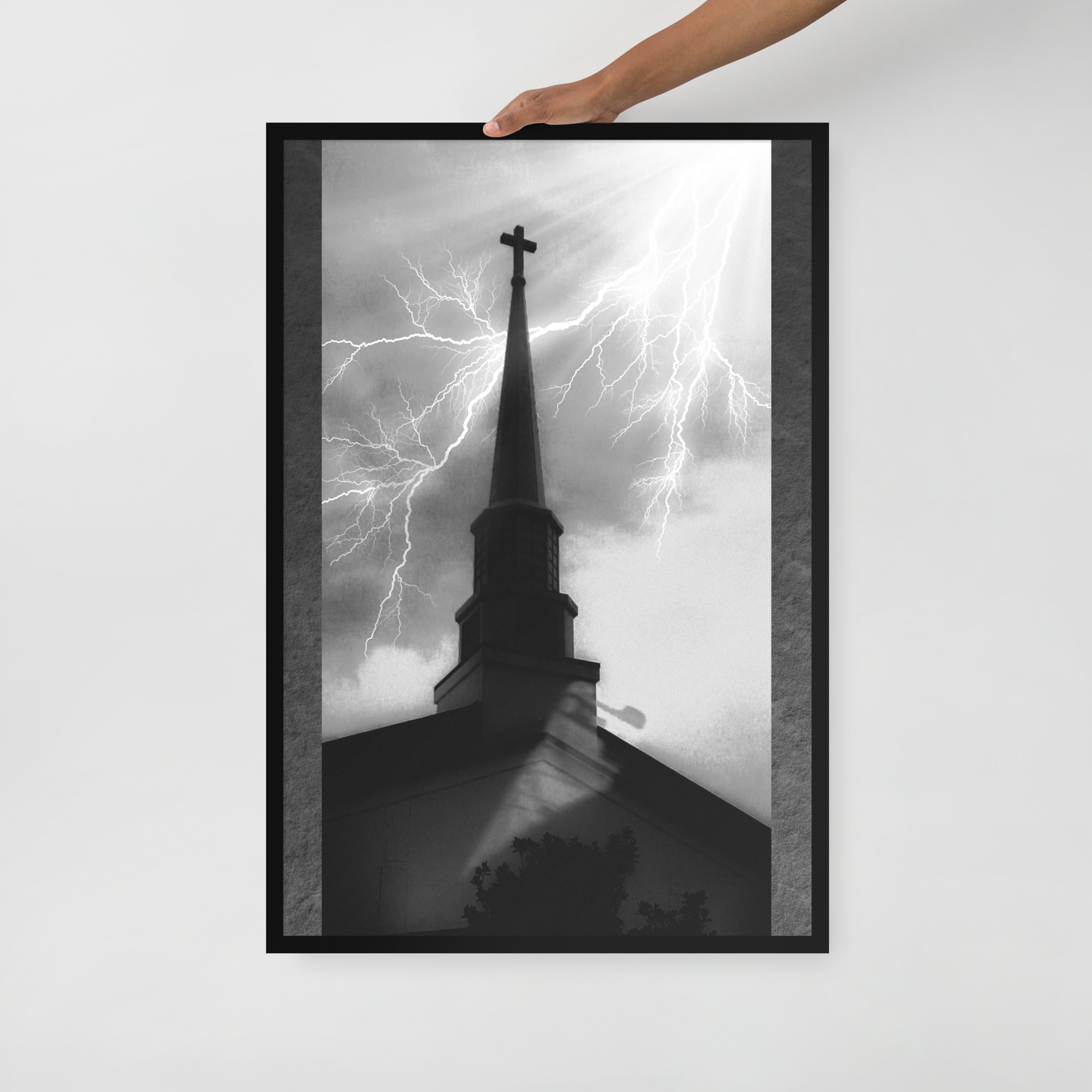 24x36 poster of a shadowy church in front of a lightning strike in grainy black and white heavy metal style being held in front of a white background