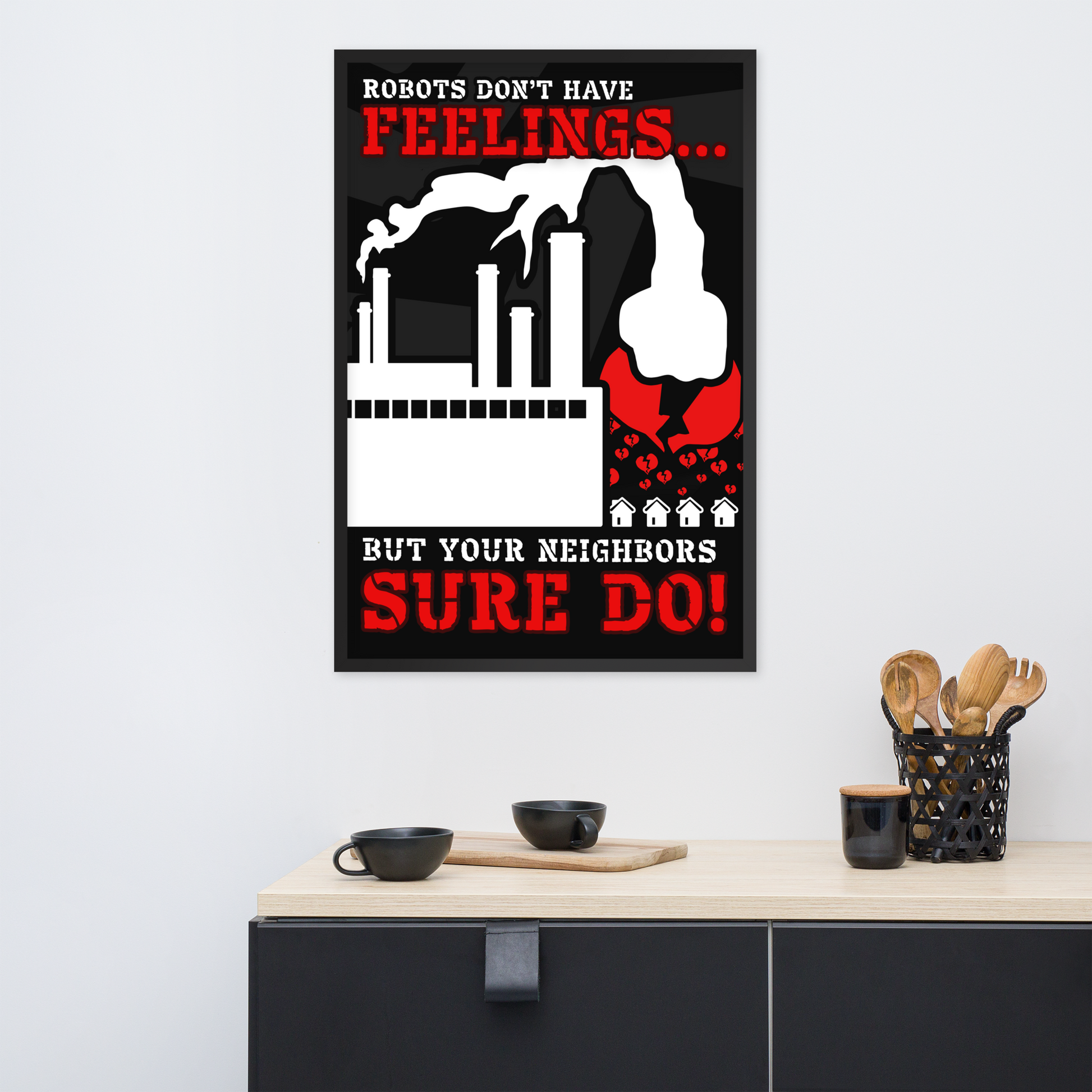 A framed black-and-red poster with the text 'ROBOTS DON'T HAVE FEELINGS.